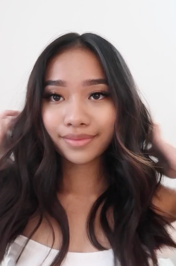 Patrizzle touching shiny hair