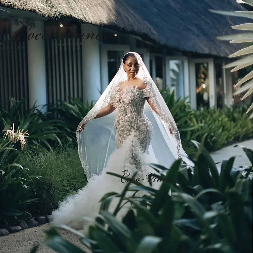 Customized Luxury Beading Mermaid Wedding Dress 2026 New Off The Shoulder Tulle Rufflus Africa Mermaid Wedding Dresses W1426