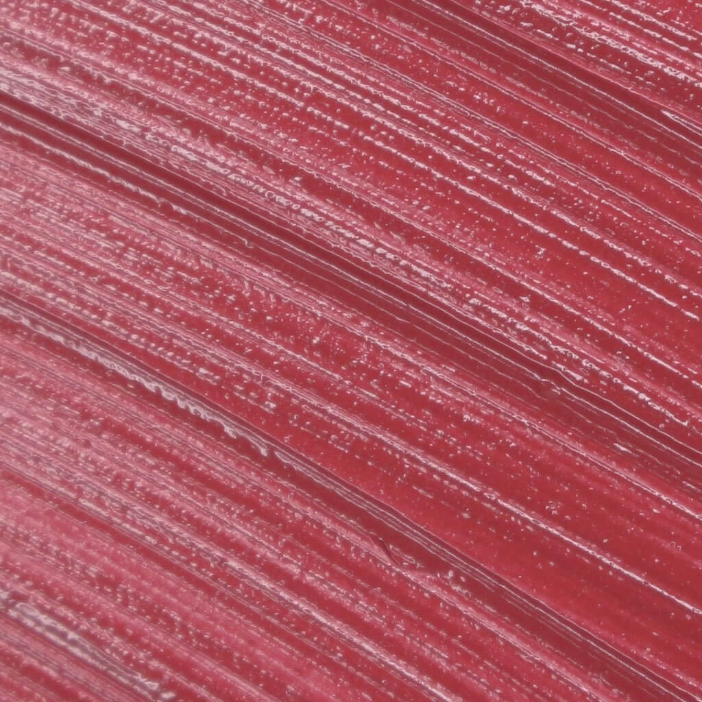 Close-up texture of Lip Fondant Liquid Lipstick in a vibrant red shade.
